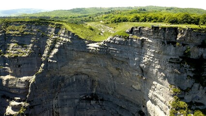 Aerial view with zoom out over cliffs of the Nervion River Canyon, in the north of the Spanish province of Burgos.