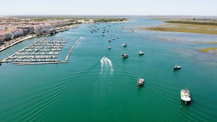 Aerial view over the village, marinas and fishing port of Punta Umbría, and the river Piedras, in the Atlantic coast of Huelva, Andalusia, Spain.