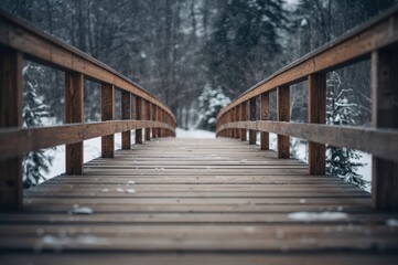 Obraz premium Snow-covered wooden footbridge captured from an angle on a cold winter day, empty and serene.