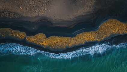 Aerial shot showcasing a river twisting and blending into the sea, emphasizing the vivid contrast between deep black volcanic sands and bright yellow river deposits.