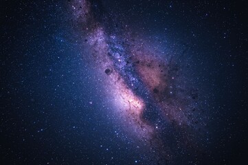 Obraz premium A star-filled night sky showcasing galaxies and the Milky Way