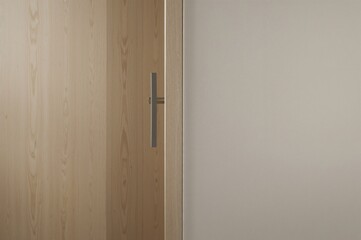A sleek office door handle set against a simple, uncluttered backdrop