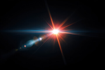 Bright light flare with orange and blue rays shining against dark background, creating dramatic and intense glowing effect