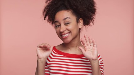 Cheerful woman waving goodbye with a smile