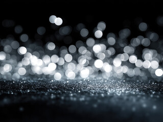 Sparkling silver glitter with bokeh light effect on dark background creating festive and elegant atmosphere for celebration or party
