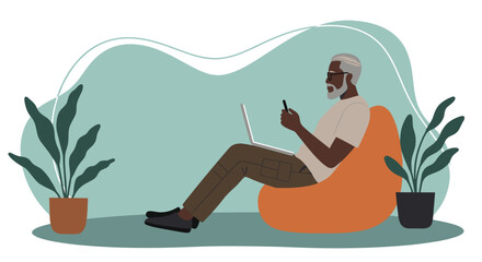Black senior man using laptop and phone on bean bag Remote work online leisure digital lifestyle