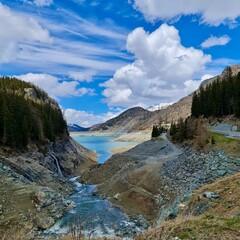 Mountain Road and Lake in Swiss Alps Landscape