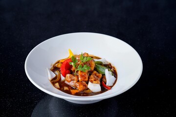 Assortment of Asian Dishes: Kung Pao Chicken, Chili Chicken, and Thai Basil Stir-fry