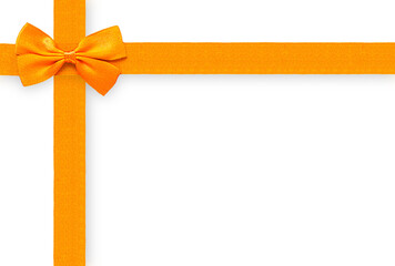 Bright satin orange ribbon and bow isolated on a transparent background, creating a gift-wrap design in the top-left corner. Excellent copy space for holiday, gift, or Autumn promotions
