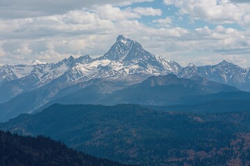 A stunning panorama of rugged, snow-covered mountains in a secluded highland area