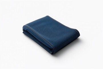 Folded denim pants displayed on a white surface