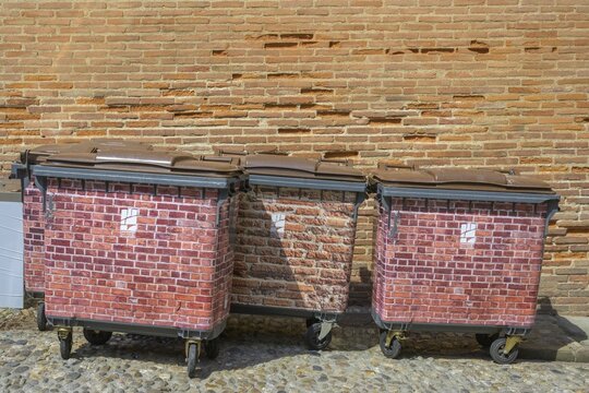Brick-look rubbish bins on Saint Salvy square, Albi, Tarn department, France