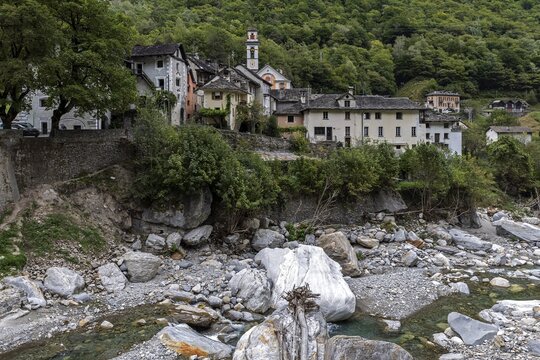 View of Prato with typical Ticino houses, foreground river Maggia, Lavizzara, Canton Ticino, Switzerland
