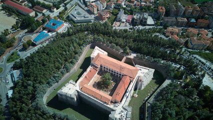Aerial drone footage of L’Aquila, Italy, showcasing historic architecture, vibrant streets, and...