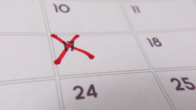 Marking the date number 17, focusing on the number highlighted with a red cross on the calendar. Represents deadlines, reminders, planning, and time management