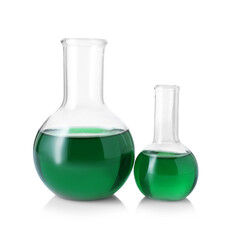 Different laboratory glassware with green liquid isolated on white