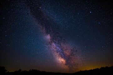 Fototapeta premium Night sky filled with stars and the Milky Way galaxy