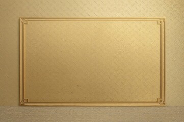 Fototapeta premium New wallpaper design showcases a golden frame set against a smooth gold backdrop, adorned with detailed line patterns and textures mimicking a metallic surface, adding a luxurious feel