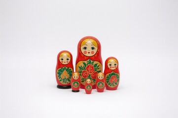 Traditional wooden nesting dolls on a plain white surface