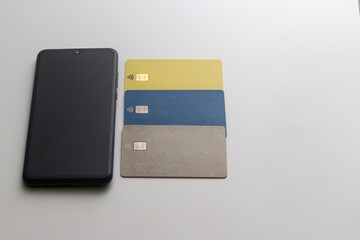 A mobile phone and credit cards are found on the table. For online shopping on Cyber ​​Monday.