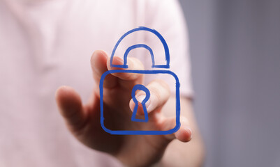 A hand interacting with a blue digital padlock icon, symbolizing data protection, online security,...
