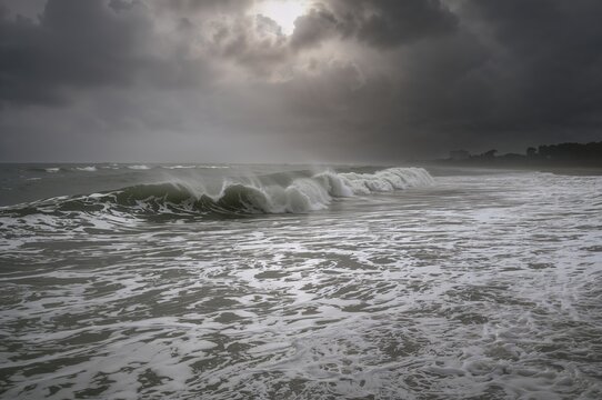 Single wave breaking during strong tides and turbulent surf in the coastal region. - Powered by Adobe