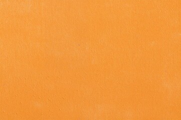 Delicate patterned texture on orange fabric