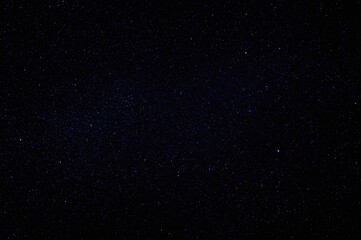 Obraz premium Twinkling constellations against a deep blue cosmic backdrop