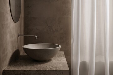 Profile of a circular basin made of brown cement in a restroom, complemented by a sleek silver faucet near a white drape.