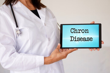 medical concepts. Crohn's disease. Female doctor with the diagnosis on her digital tablet.
