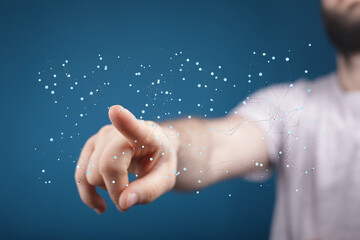 Abstract image of a hand interacting with a digital network.  Perfect for technology, connection, and innovation concepts.