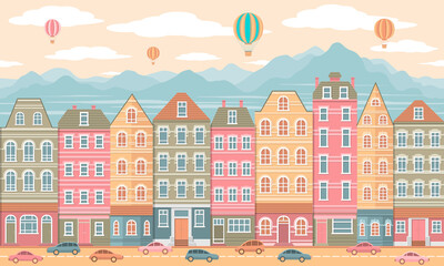 Children's illustration of cute light green, pink and beige houses on the background of high mountains, air balloons in the sky and cars on the road. Seamless horizontal pattern of a city street.