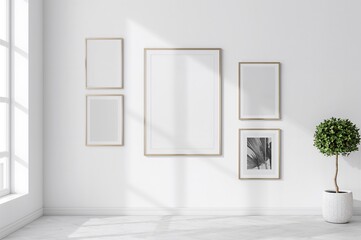 Minimalist poster design in a contemporary room featuring frames of multiple dimensions