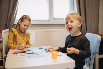 Fototapeta premium Children doing creative craft activities at home