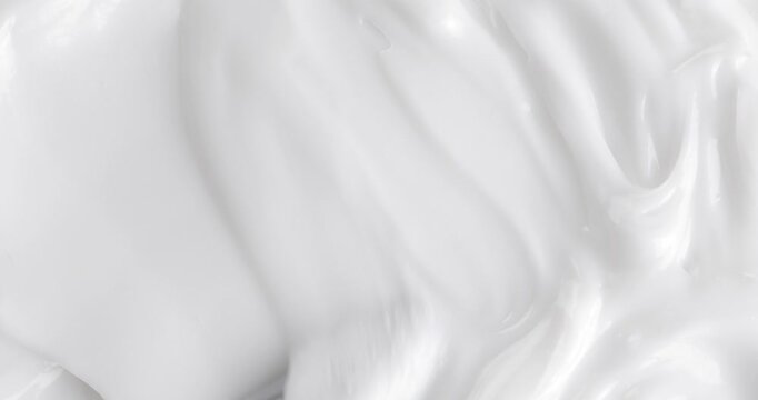 Smear of moisturizing cream made with a spatula, close-up footage, cream texture.