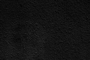 Black dark rough old wall in shadow. Abstract background