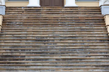 Beautifully Weathered Stone Steps Leading Up to a Magnificent Grand Entrance of a Building