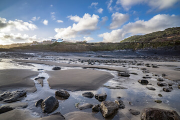 Morning rock pools at low tide at Crackington Haven