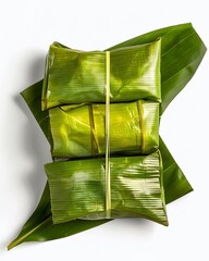 Wrapped culinary delight: an appetizing trio of food parcels meticulously packaged within verdant, natural leaves, each exuding an allure of culinary excellence.
