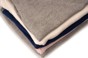 A group of warm sweaters isolated on a white background.