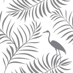 Elegant grey silhouette of a heron bird standing amidst lush palm leaves on a clean white background creating a tropical minimalist pattern