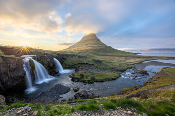 sunset over Mount Kirkjufell and the waterfall Kirkjufellsfoss, Snaefellsnes Peninsula, West Iceland