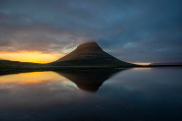Mount Kirkjufell and its reflection at night during midnight sun, Snaefellsnes Peninsula, West Iceland