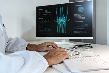 Doctor examining AI-powered medical insights and joint stress analysis on screen, advancing orthopedic diagnostics