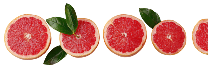 Slices of vibrant red grapefruit with leaves