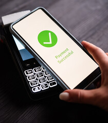Girl Paying With Smartphone Over Wireless Terminal With Payment Approved Status On A Screen