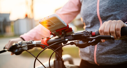 Girl With Bike Using Phone Gps On Handlebars