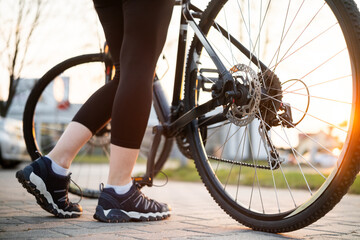Girl Legs With Mountain Bike In Park