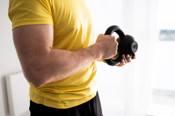 Sporty Man Doing Home Workout With Dumbbells