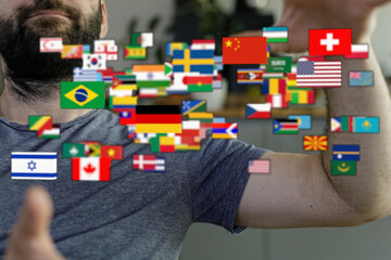 Image of a man with a beard surrounded by flags from around the world, symbolizing globalization,...